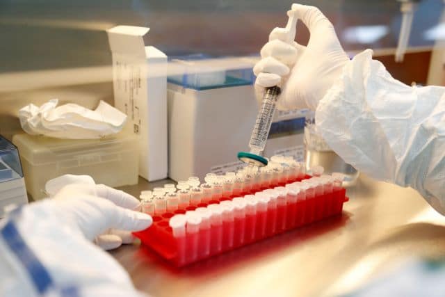 FILE PHOTO: A scientist filters out samples during the research and development of a vaccine against the coronavirus disease (COVID-19) at a laboratory of BIOCAD biotechnology company in St Petersburg, Russia June 11, 2020. REUTERS/Anton Vaganov/File Photo