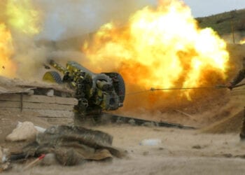 An ethnic Armenian soldier fires an artillery piece during a military conflict over the breakaway region of Nagorno-Karabakh, in this handout picture released October 5, 2020. Picture released October 5, 2020. Press office of Armenian Defense Ministry/PAN Photo/Handout via REUTERS ATTENTION EDITORS - THIS IMAGE HAS BEEN SUPPLIED BY A THIRD PARTY. MANDATORY CREDIT.