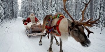 FILE PHOTO: Santa Claus rides in his sleigh as he prepares for Christmas in the Arctic Circle near Rovaniemi, Finland December 15, 2016. REUTERS/Pawel Kopczynski/File Photo