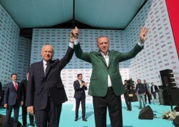 epa07445044 A handout photo made available by  the Turkish President Press office shows Turkish President Recep Tayyip Erdogan (R) and  leader of Nationalist Movement Party (MHP)  Devlet Bahceli (L) as they greet their supporters during his Justice and Development Party (AK Party) and Nationalist Movement Party (MHP) local election campaign rally in Izmir, Turkey, 17 March 2019. Local elections in Turkey are scheduled for 31 March 2019.  EPA/TURKISH PRESIDENT PRESS OFFICE HANDOUT  HANDOUT EDITORIAL USE ONLY/NO SALES