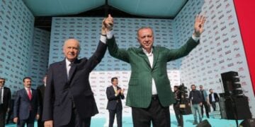 epa07445044 A handout photo made available by the Turkish President Press office shows Turkish President Recep Tayyip Erdogan (R) and leader of Nationalist Movement Party (MHP) Devlet Bahceli (L) as they greet their supporters during his Justice and Development Party (AK Party) and Nationalist Movement Party (MHP) local election campaign rally in Izmir, Turkey, 17 March 2019. Local elections in Turkey are scheduled for 31 March 2019. EPA/TURKISH PRESIDENT PRESS OFFICE HANDOUT HANDOUT EDITORIAL USE ONLY/NO SALES