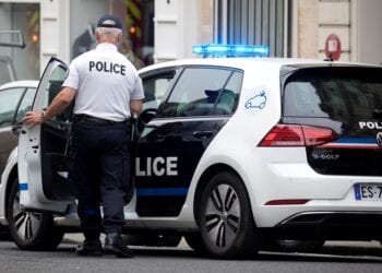 A policeman enters a new Volkswagen e-Golf electric vehicle for Paris police in Paris, France, June 19, 2018.  REUTERS/Charles Platiau