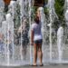 epa06918800 A girl cools herself with the water of a fountain in Budapest, Hungary, 30 July 2018, as the highest daytime temperature may reach 35 centigrades in most parts of the country, and the highest degree heat alert has been issued by the Hungarian health authority.  EPA/Zsolt Szigetvary HUNGARY OUT