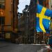 Swedish flags fly from a tourist souvenir shop in Gamla Stan in Stockholm, Sweden, on Thursday, March 26, 2020. Sweden is starting to look like a global outlier in its response to the coronavirus. Photographer: Mikael Sjoberg/Bloomberg